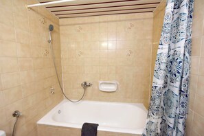 Shower, hair dryer, towels, shampoo