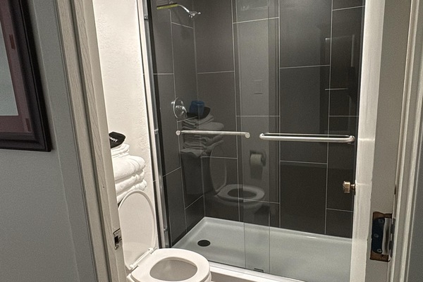 Standard Room, 2 Queen Beds, Non Smoking | Bathroom | Combined shower/tub, free toiletries, hair dryer, towels