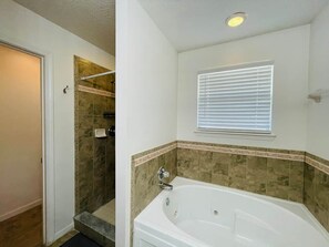 Shower, jetted tub, hair dryer, soap