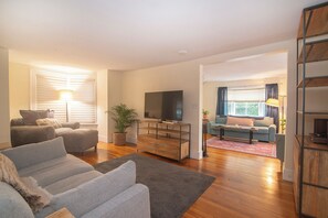 Smart TV, fireplace, books, printers