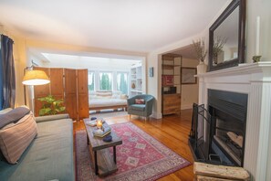 Smart TV, fireplace, books, printers