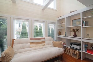 Smart TV, fireplace, books, printers