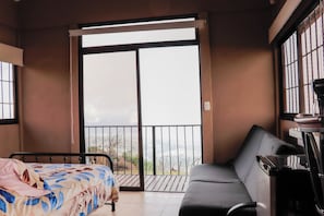 Habitación Deluxe con 1 cama matrimonial o 2 individuales, vista a la ciudad | Wifi gratis
