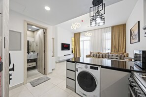 Departamento Deluxe, balcón, vista a la ciudad | Cocina privada