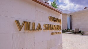A villa named "Villa Shana" with a modern architectural design, featuring a prominent nameplate on the exterior wall. - Villa Shanaya Pererenan (Canggu)