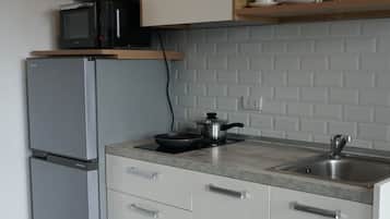 Apartamento, sacada | Cozinha americana privada