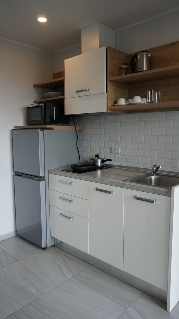 Apartamento, sacada | Cozinha americana privada