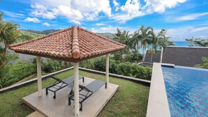 A rooftop pool area with a tiled pergola, lounge chairs, and a view of the ocean. -  Katamanda Villa Allegra 5BR Seaview villa Kata (Karon)