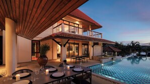 A modern villa with a pool, dining area, and outdoor seating. -  Katamanda Villa Allegra 5BR Seaview villa Kata (Karon)