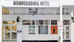 The exterior of the Ambassadors Hotel with a sign indicating it is now open. - AMBASSADORS HOTEL ADELAIDE (Adelaide)
