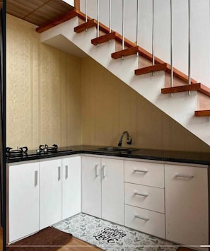 Family Room, Balcony | Private kitchen