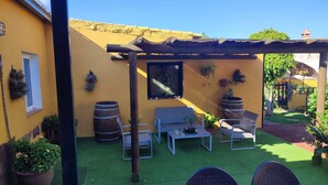 A patio with a pergola, seating area, and potted plants. - El Trazo, perfect to disconnect. (tacoronte)