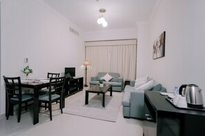 Living area - Alraya Homes by Betu former Times Inn - Deluxe Studio (Abu Dhabi)