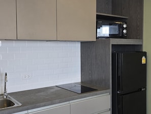 Apartamento, sacada | Cozinha americana privada