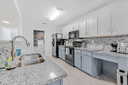 Spacious one level 4-bedroom house fully furnished with 2 car garage & backyard