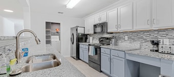 Spacious one level 4-bedroom house fully furnished with 2 car garage & backyard
