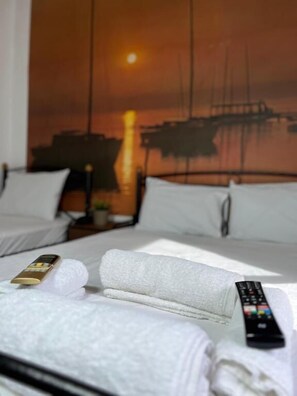 Economy Triple Room (10) | Iron/ironing board, free WiFi, bed sheets