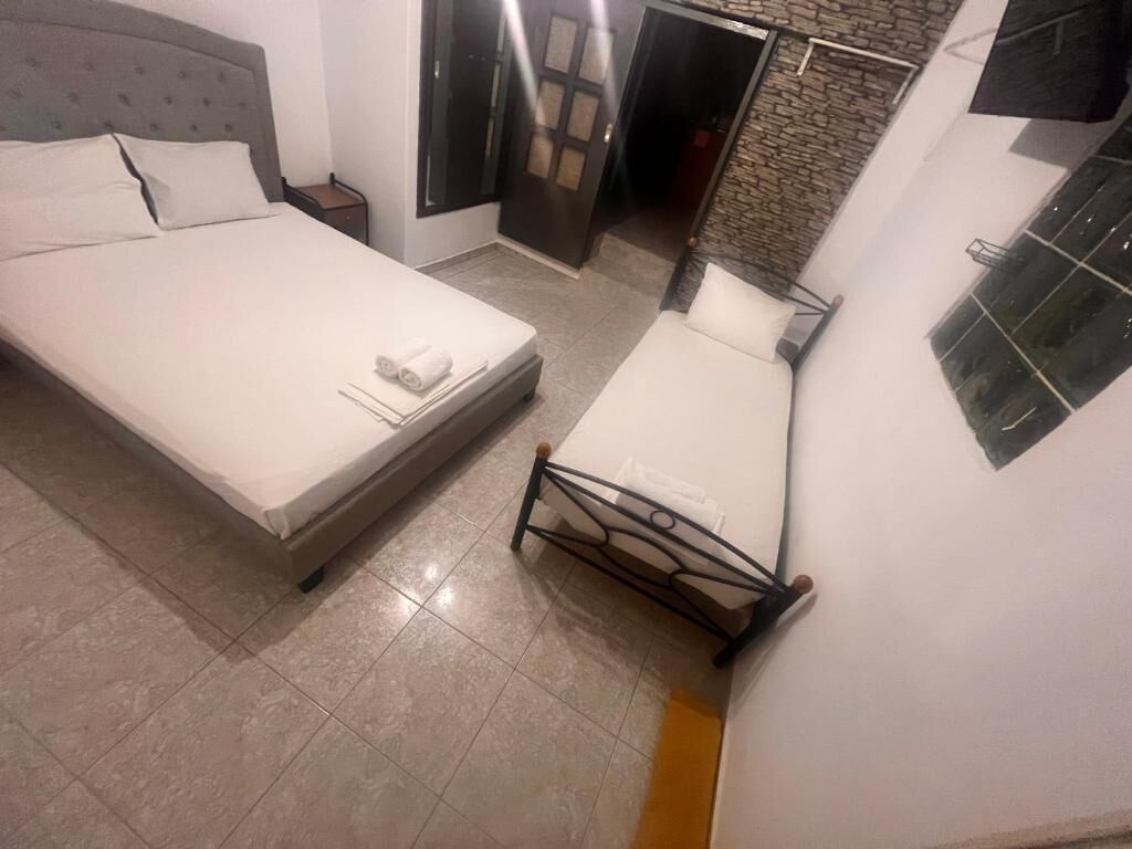 Economy Triple Room (11) | Iron/ironing board, free WiFi, bed sheets