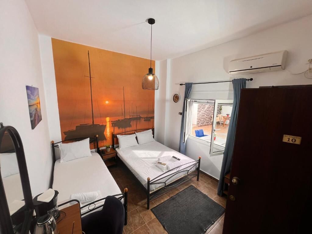 Economy Triple Room (10) | Iron/ironing board, free WiFi, bed sheets