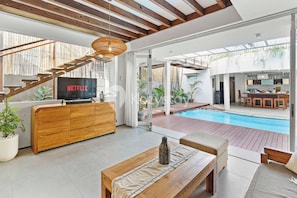 Villa, 3 Bedrooms, Pool View | Living area | 43-inch Smart TV with cable channels, Netflix, streaming services - Ombak Villa by Kozystay - Canggu (Canggu)