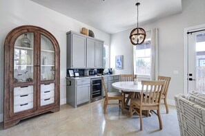 Fridge, microwave, coffee/tea maker, cookware/dishes/utensils