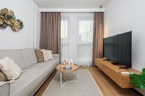 LĂ€genhet Classic - 3 sovrum - balkong | Vardagsrum | 40-tums LCD-tv med digitalkanaler