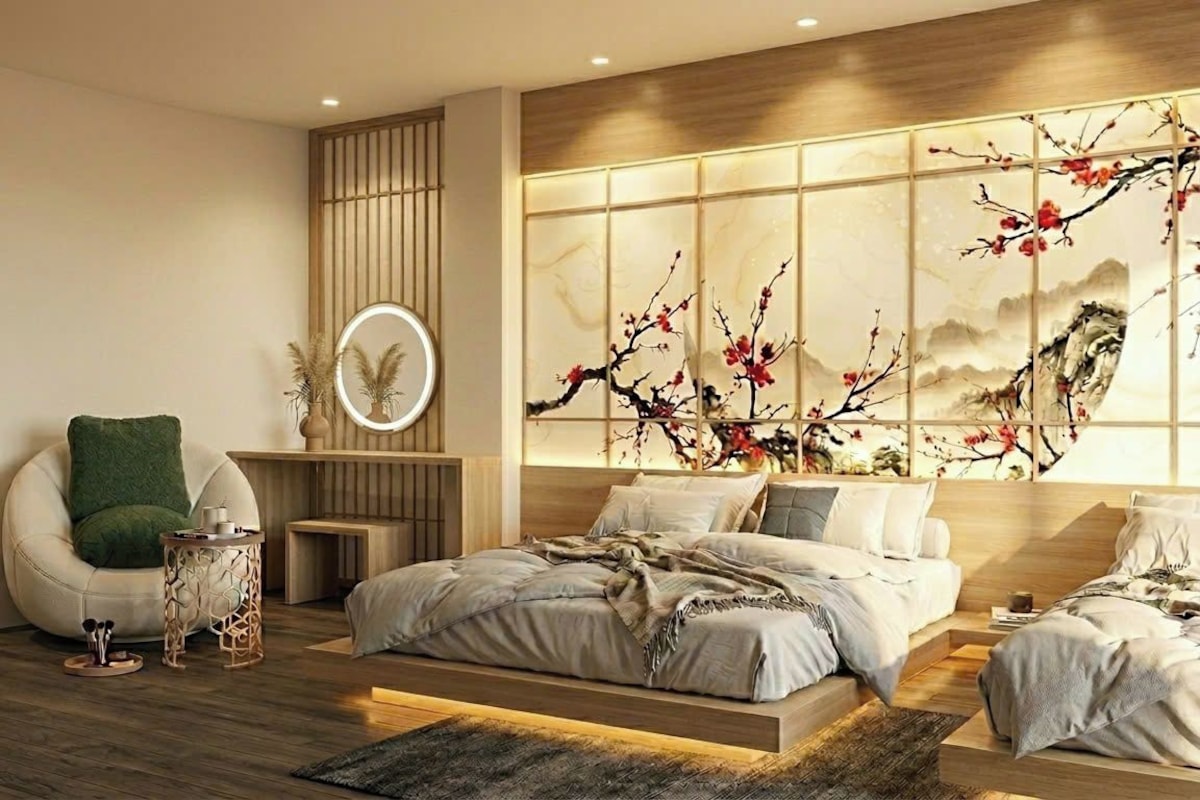 Un dormitorio moderno con una cama grande, una zona de estar y una pared decorativa.