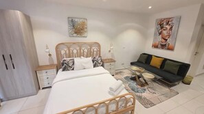 Deluxe Studio Suite, Balcony, City View | Desk, laptop workspace, iron/ironing board, free WiFi