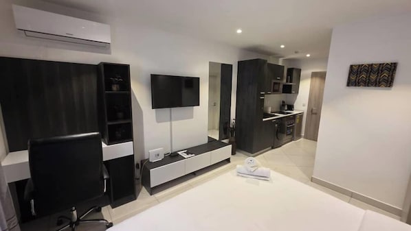 Executive Apartment, Balcony, Garden View | Desk, laptop workspace, iron/ironing board, free WiFi