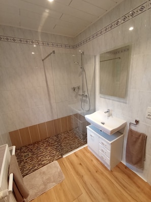 Shower, hair dryer, towels, soap