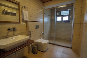 Shower, free toiletries, slippers, soap