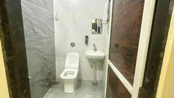 Shower, rainfall showerhead, slippers, towels