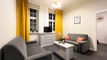 Apartment, Courtyard View | Living room | Flat-screen TV