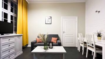 Apartment, Courtyard View | Living room | Flat-screen TV