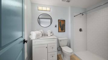 Shower, hair dryer, towels, shampoo