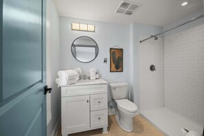 Shower, hair dryer, towels, shampoo