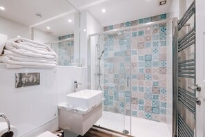 Shower, hair dryer, towels, soap