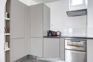 Fridge, microwave, stovetop, coffee/tea maker