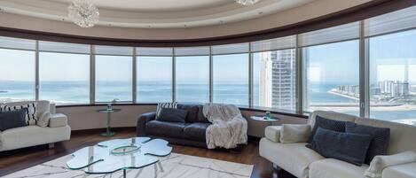 Deluxe Apartment, 4 Bedrooms, Non Smoking, Marina View | Living area | 55-inch Smart TV with cable channels, streaming services