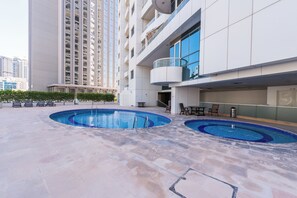 Outdoor pool, pool umbrellas, sun loungers