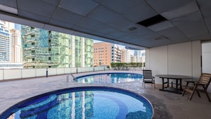 A rooftop pool with a clear view of surrounding buildings. - EDEN'S Homes & Villas - KG tower (Dubai)