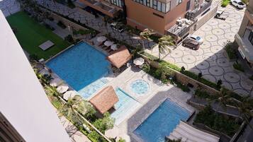 Deluxe Twin Room, Pool View | In-room safe, soundproofing, iron/ironing board, free WiFi