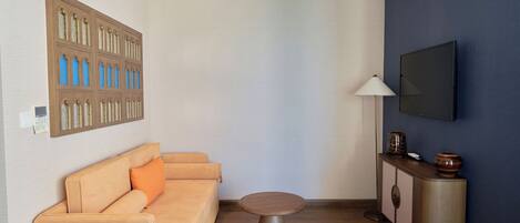 Apartment, Sea View | Living area | TV