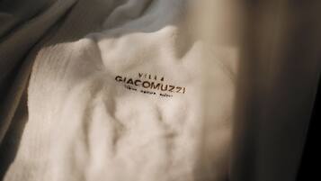 A white fabric with the text 'VILLA GIACOMUZZI' visible.