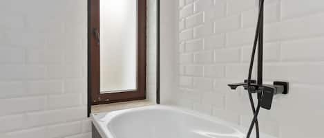 Shower, hair dryer, towels, shampoo