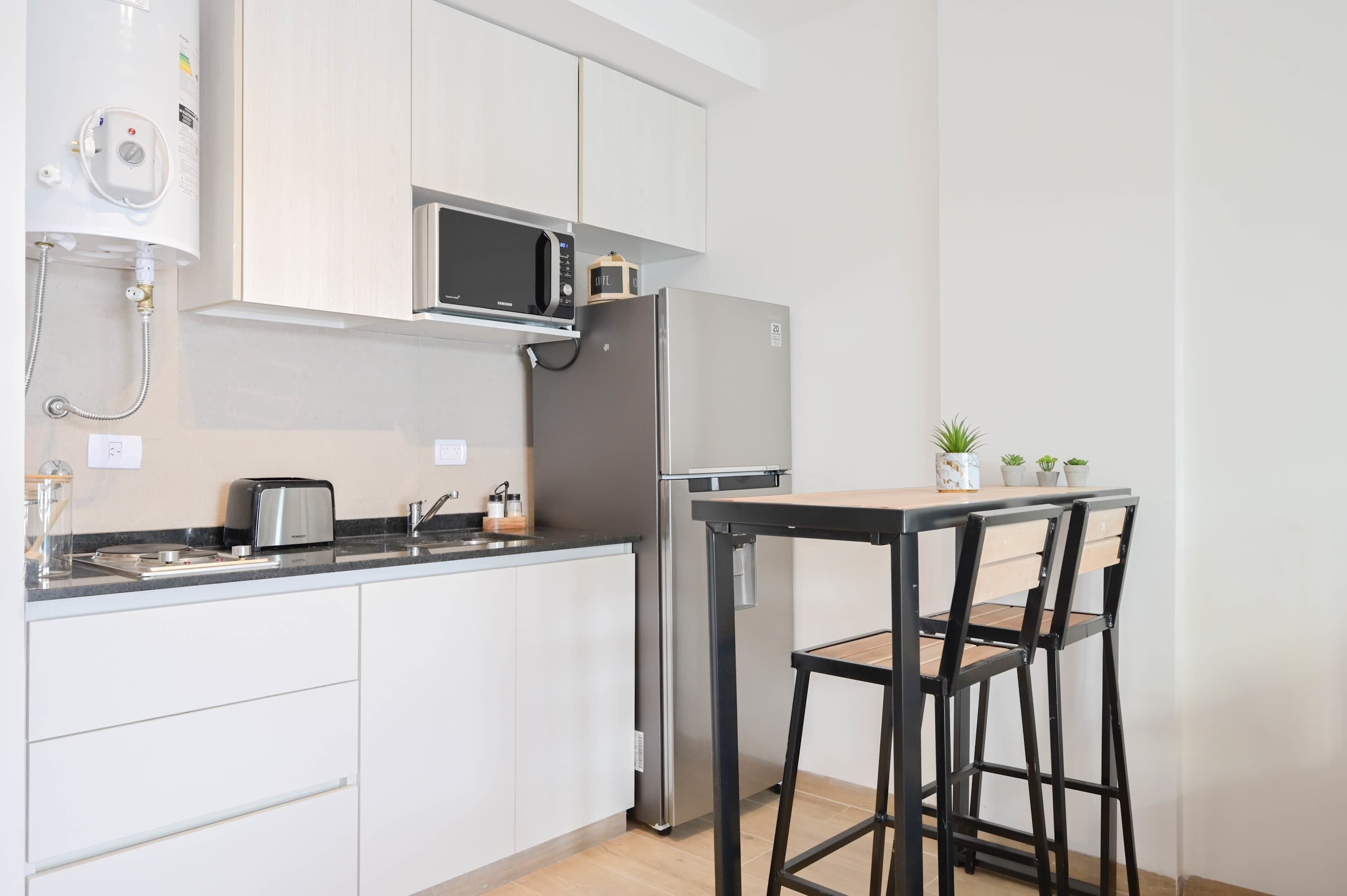 Microwave, coffee/tea maker, toaster, cookware/dishes/utensils