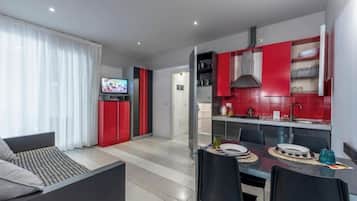 Suite, balkon | Area keluarga | TV