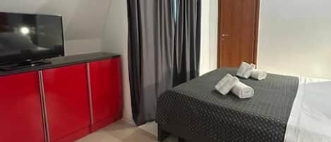 Basic Apartment, Balcony | In-room safe, iron/ironing board, cribs/infant beds, rollaway beds