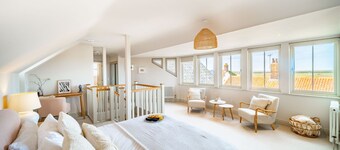 White Horses is a pretty-as-a-picture Norfolk pebble maisonette, with an absolutely stunning panoram