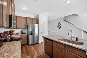 Townhome, 3 Bedrooms | Private kitchen | Fridge, oven, coffee/tea maker, toaster